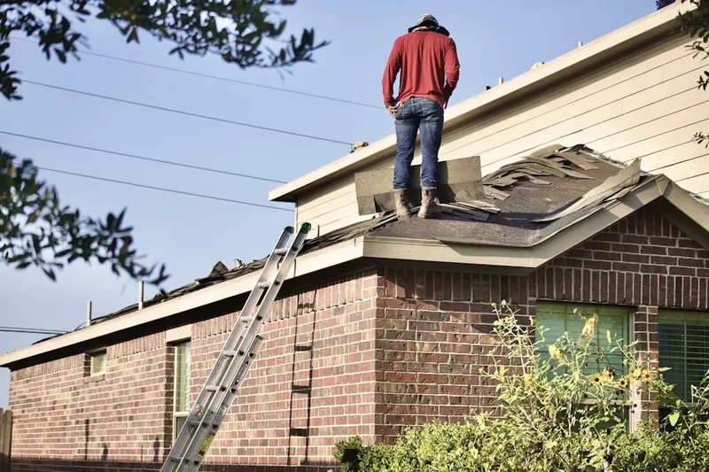 Professional roofer working on a residential roof in Biltmore Park